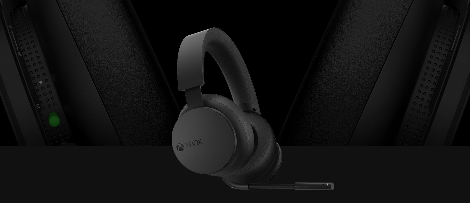 Front angled view of the Xbox Wireless Headset. A larger detailed view of the earcups is pictured behind the headset.