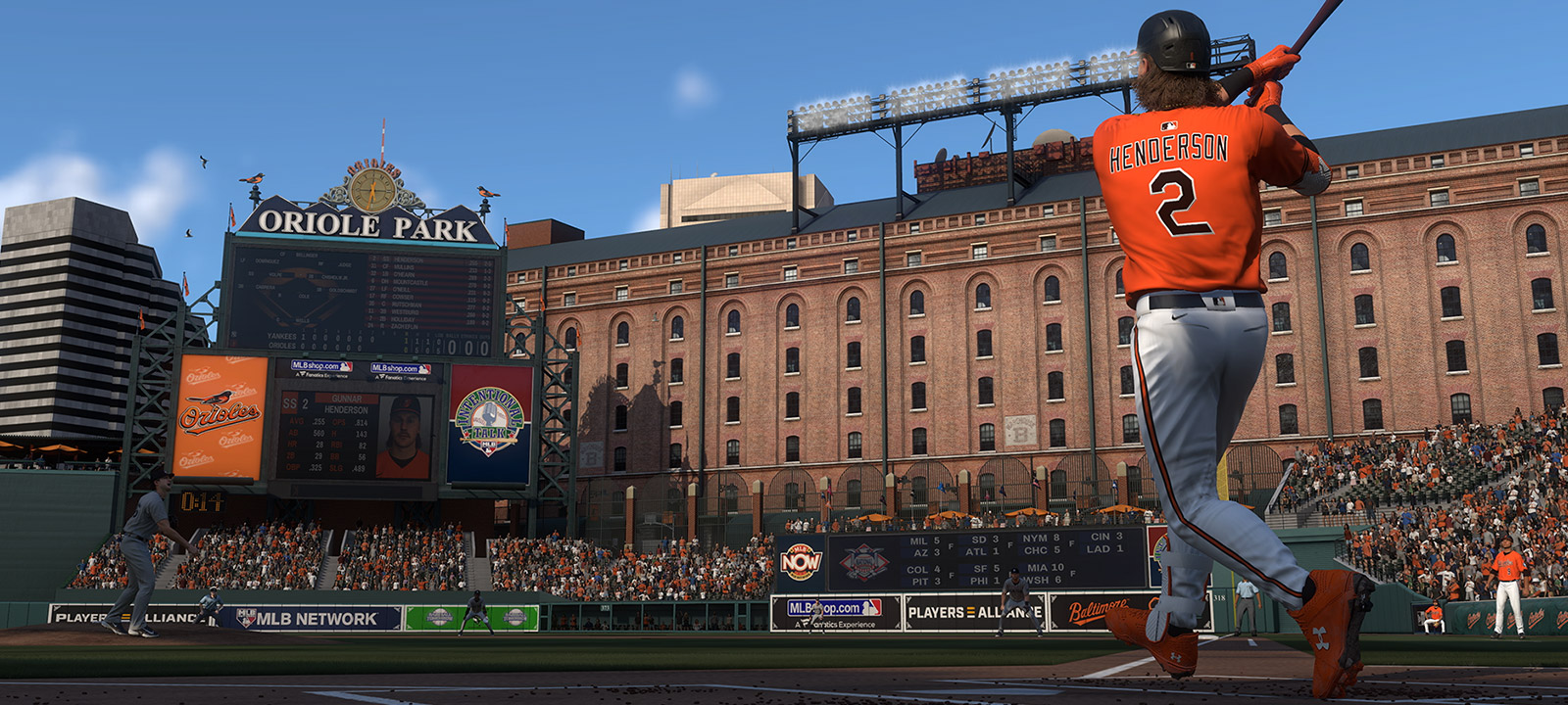 Gunner Henderson wearing a number 2 Baltimore Orioles jersey hitting a ball high into the sky.