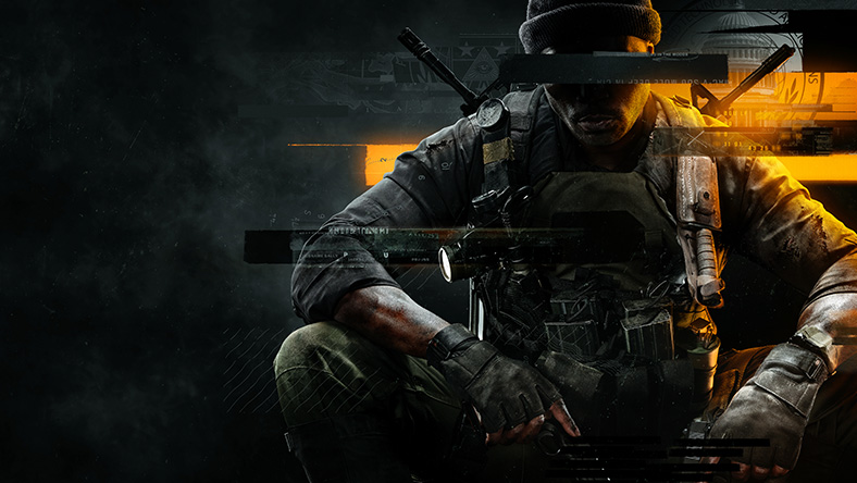 A soldier sits with his arms in his lap, a redacted line across his face.