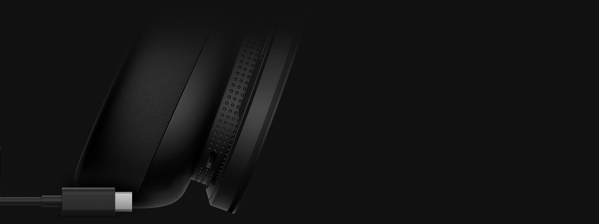 A close-up of a USB-C cable and the USB-C port on the Xbox Wireless Headset, indicating the internal battery can be recharged with a USB-C cable.